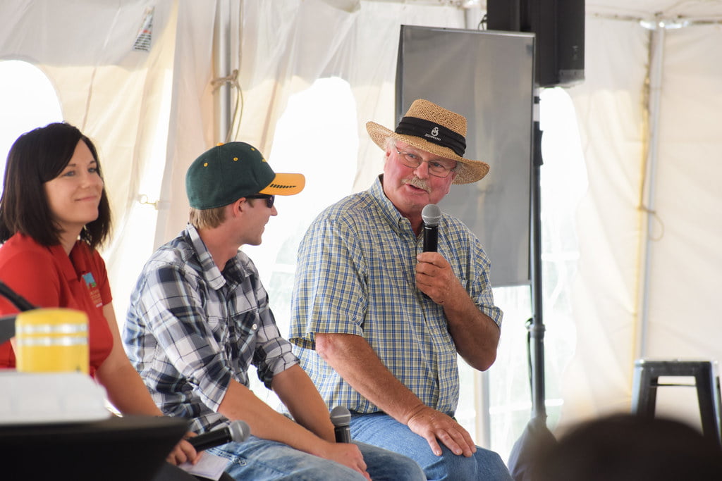 Man speaking on a panel at Grand Farm