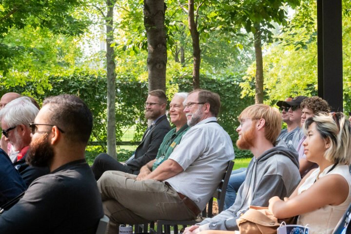 People listening to people speaking.