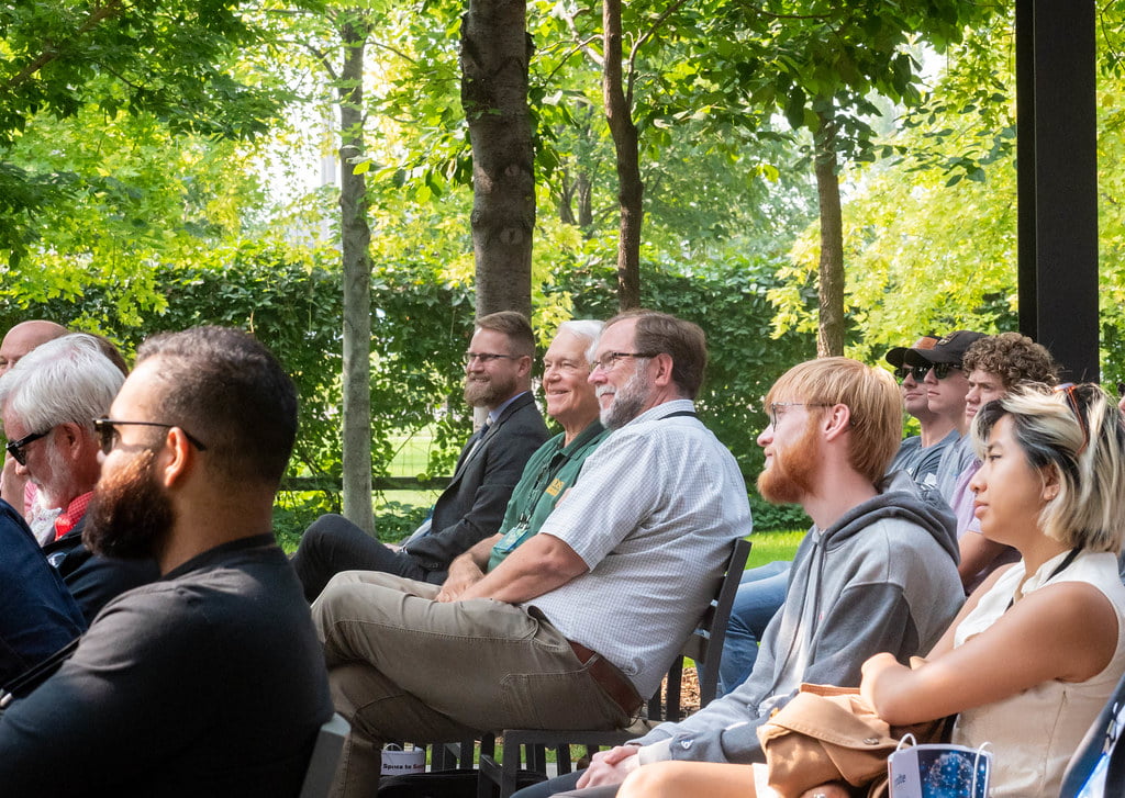 People listening to people speaking.