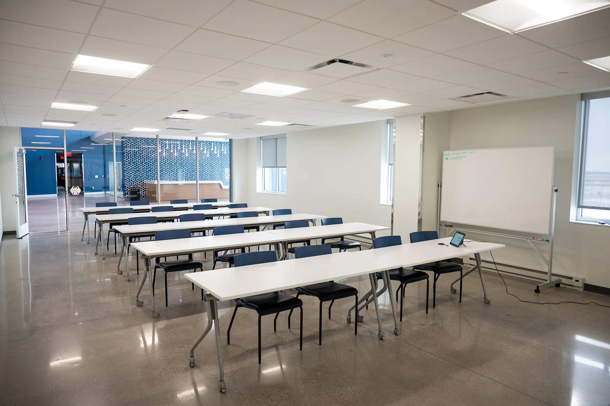 View of the Grand Farm Innovation Shop Classroom - front of room featuring tables and chairs